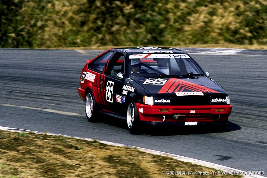 Mr. Tsuchiya racing in an AE86 at the Japan Touring Car Championship with Tsuchiya Engineering's symbolic Advan Works Color and car number “25”