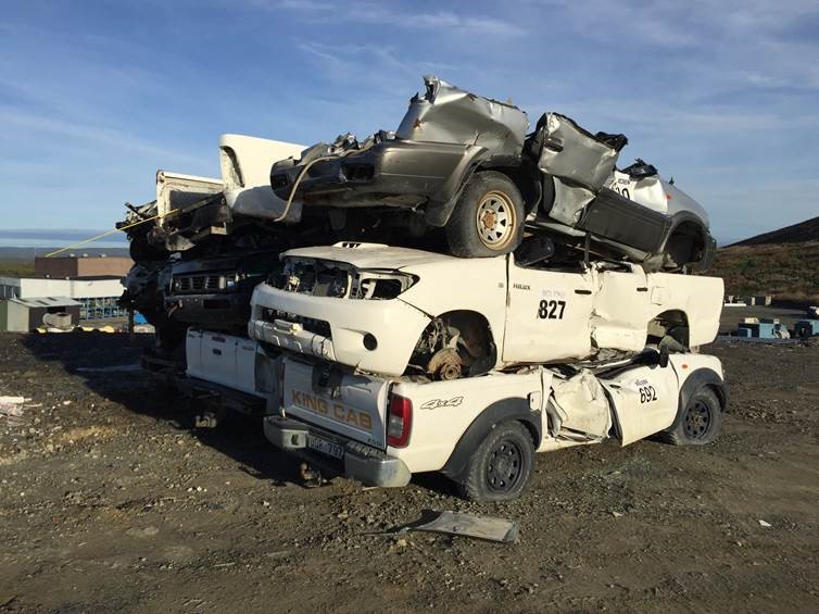 Big trucks deliberately drive over end-of-life Hilux