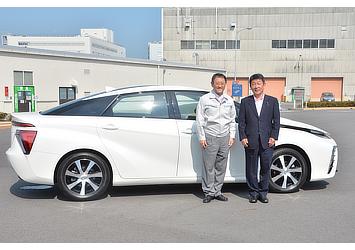 Akio Toyoda, Toyota president (left) and Toshimitsu Motegi, Japanese Minister of Economy, Trade and Industry (right) pictured with Toyota's fuel cell sedan