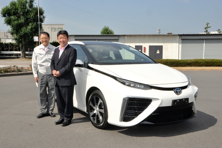 Akio Toyoda, Toyota president (left) and Toshimitsu Motegi, Japanese Minister of Economy, Trade and Industry (right) pictured with Toyota's fuel cell sedan