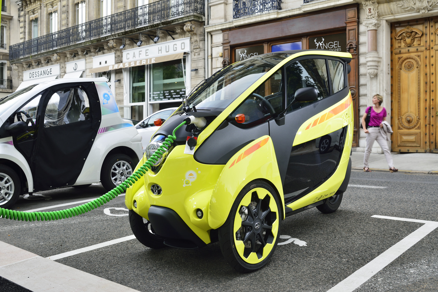 Toyota i-ROAD and COMS at a charging station for 