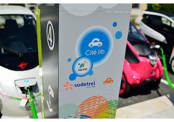 Toyota i-ROAD and COMS at a charging station for "Cité lib by Ha:mo" EV sharing trial in Grenoble, France