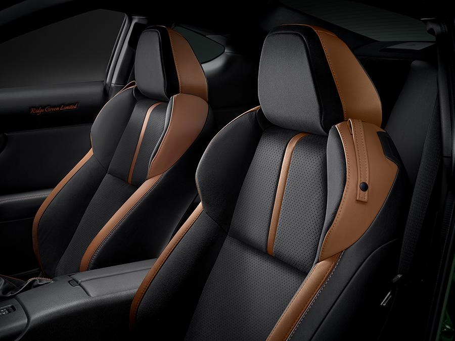 Seat upholstery: Ultrasuede® (black with perforations and tan accents) plus leather