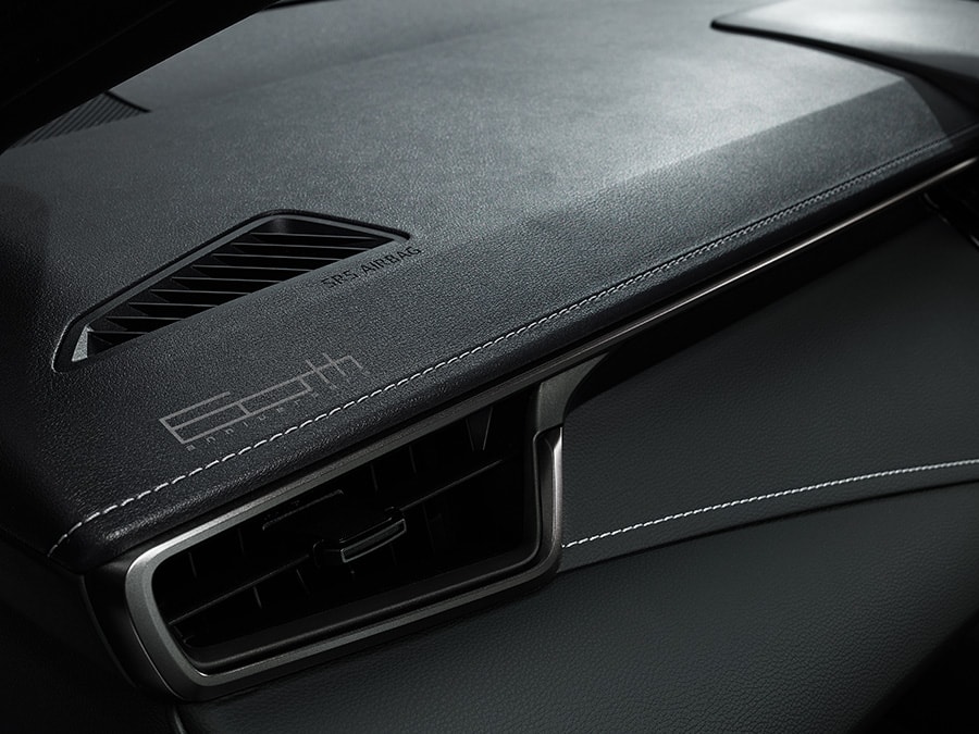 Commemorative logo on synthetic leather-wrapped instrument panel