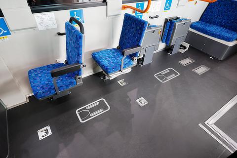 One-touch wheelchair securement device