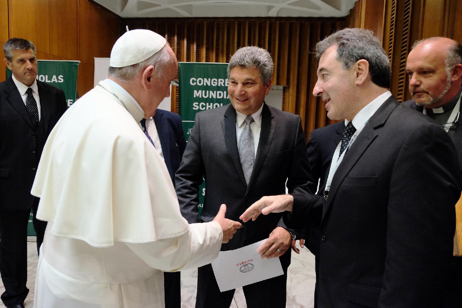 Pope Francis, Toyota Motor Corporation Regional CEO for Latin America and the Caribbean Steve St. Angelo, and President of Toyota Argentina Daniel Herrero